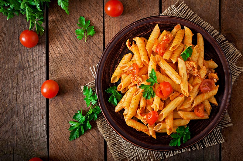 Delicious pasta dish with tomatoes and herbs